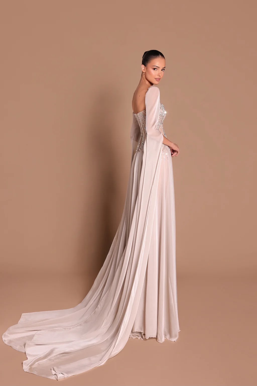 Cape gown from behind showing flowing train